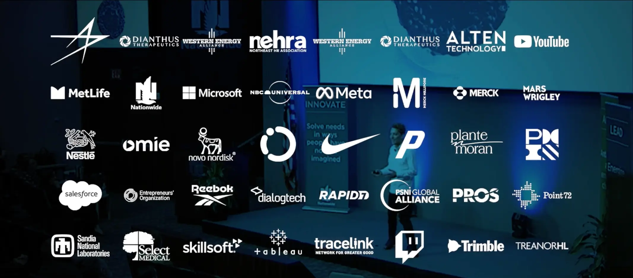 Abstract gradient pattern with dark blue transitioning to orange and blurred red spots forming wave-like horizontal lines.