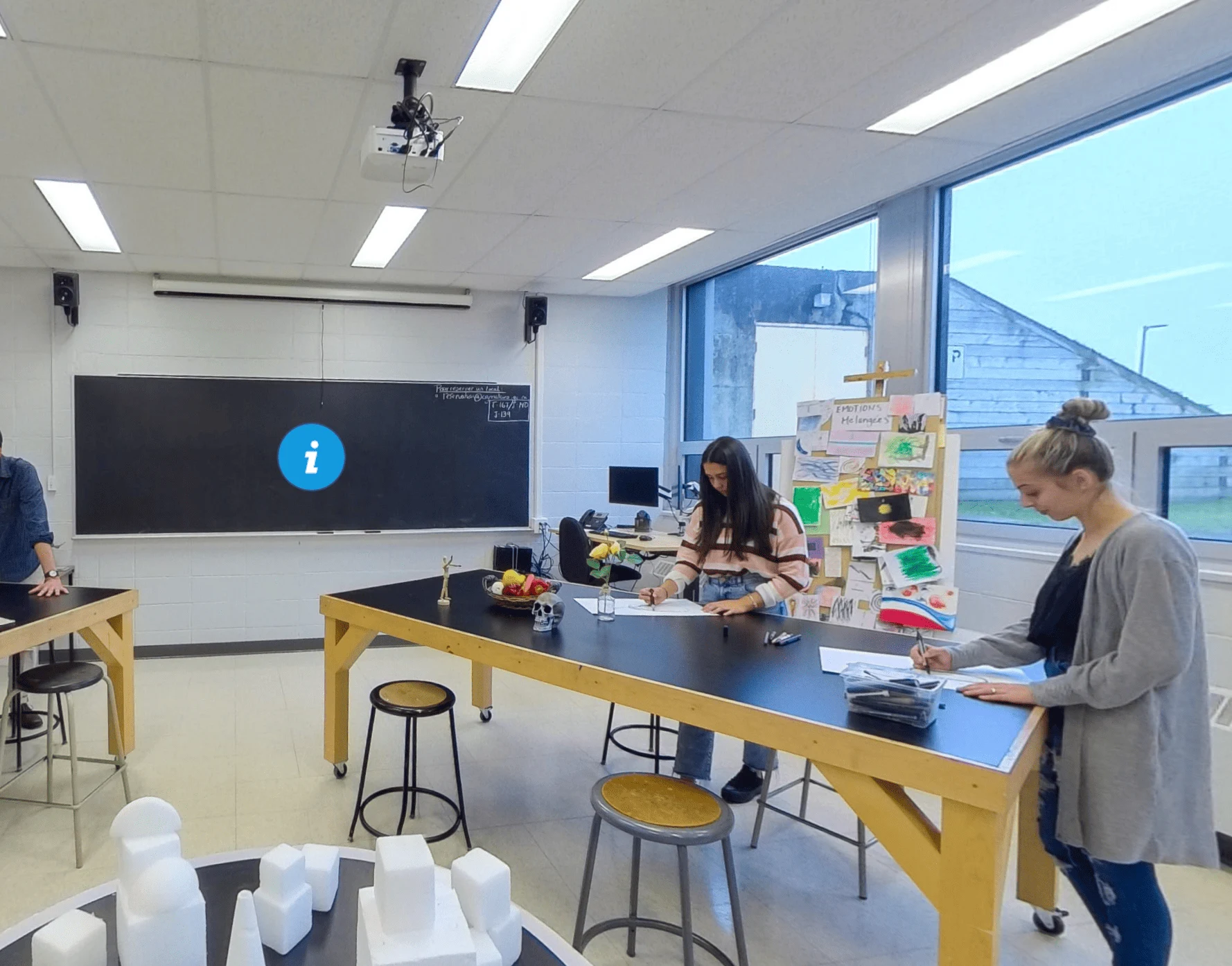 Man in navy blazer standing in a modern kitchenware store with Ricardo-branded products and culinary tools displayed.