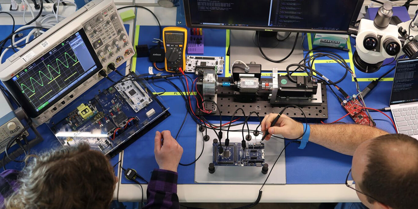 Two engineers testing with the MX Meter