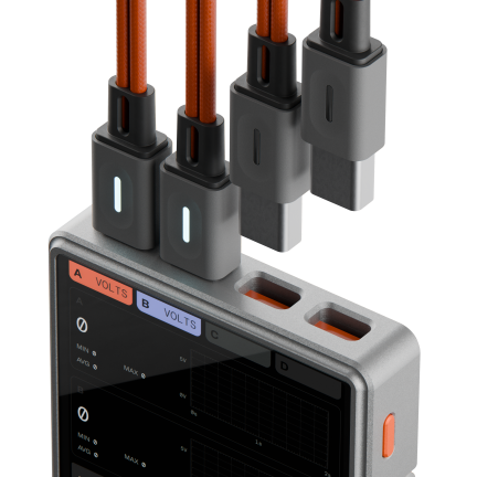 Close-up of a device with four orange cables connected to labeled ports A, B, C, and D.