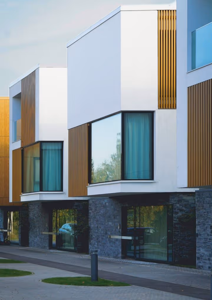 Recently completed modern townhouses with white and wooden facade