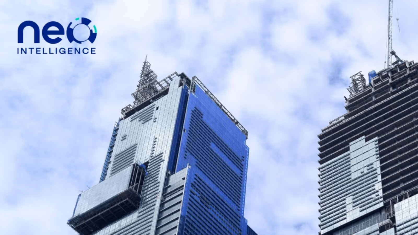 View from the ground up towards 2 high-rise buildings under construction
