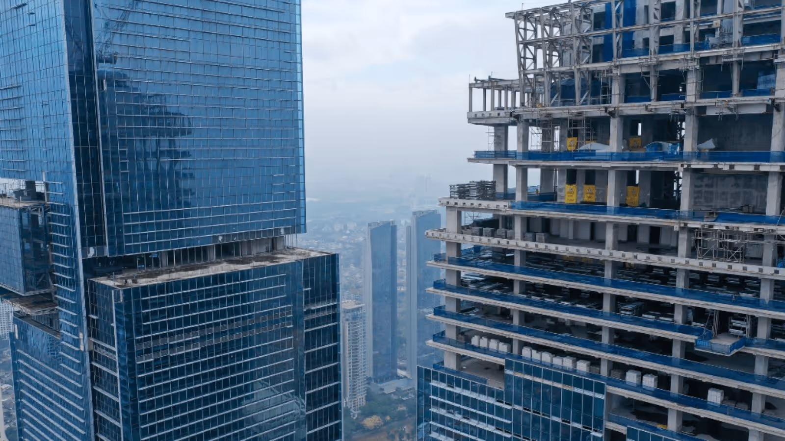 construction site with two high-rise buildings in a large city