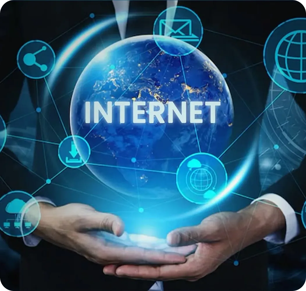 Person holding glowing digital globe with the word INTERNET and network icons around it.