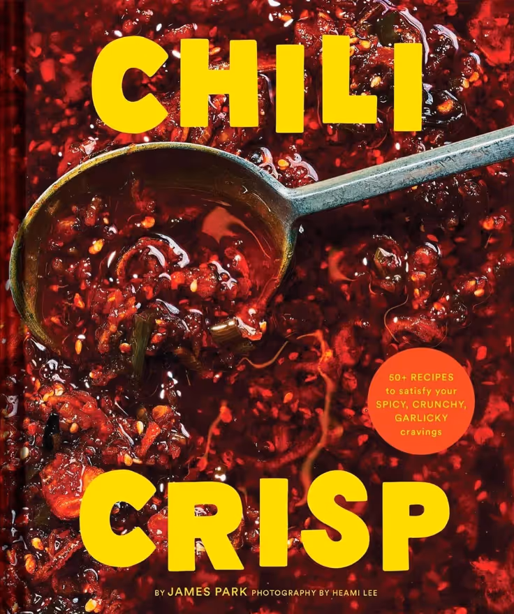 Cover of the book titled 'Chili Crisp' with a close-up image of chili crisp sauce and a metal spoon.