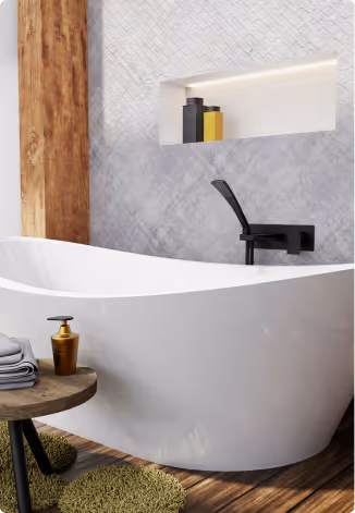 Modern white freestanding bathtub with black faucet, a wooden side table holding a soap dispenser and towels, and built-in shelf with bottles in a bathroom.