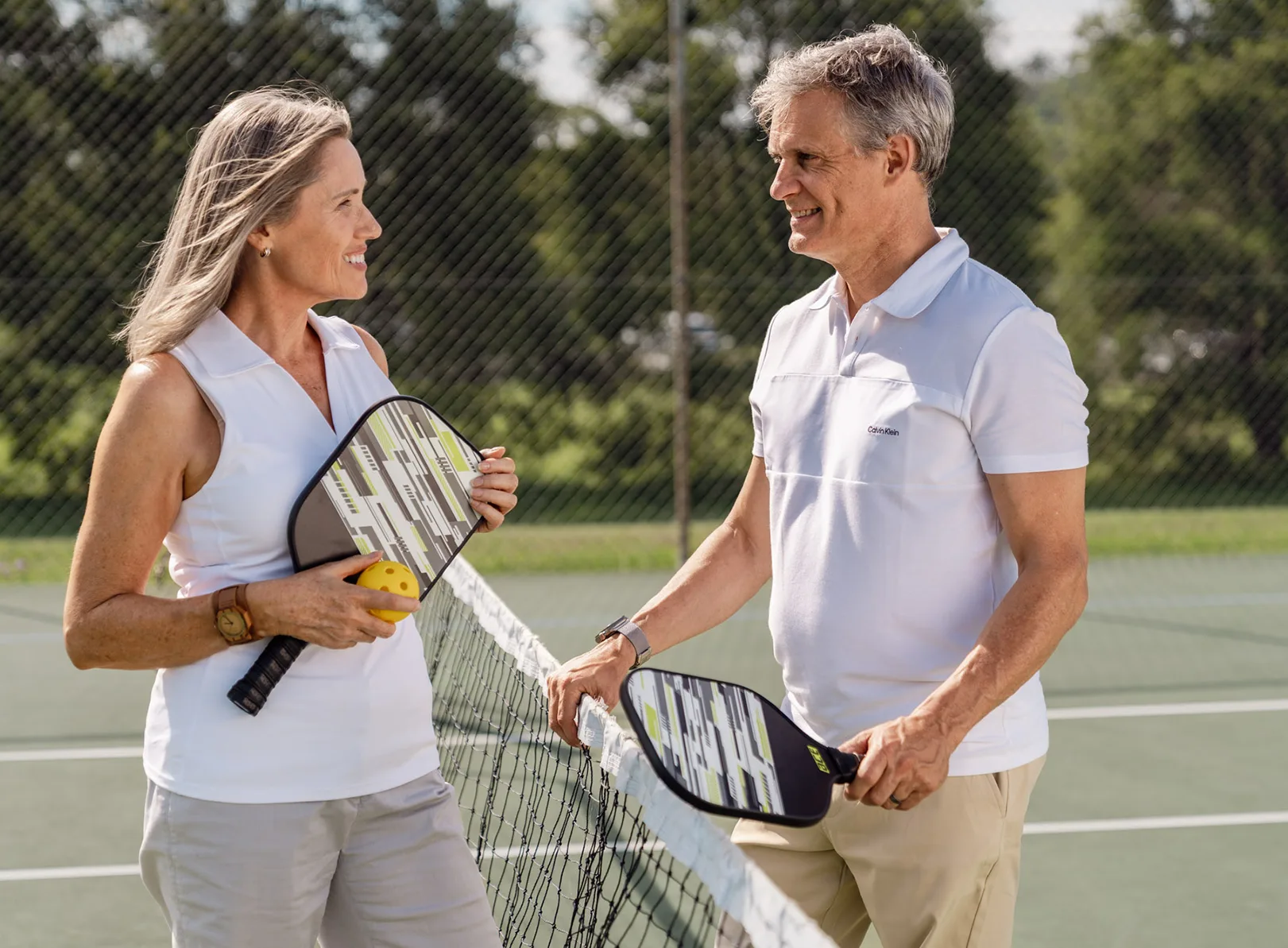 A couple playing pickle ball.