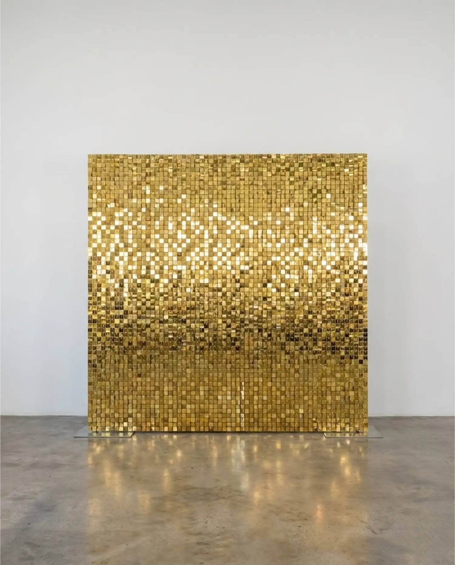 Gold shimmer wall rental in front of a white wall in a Dallas venue available for rent. 