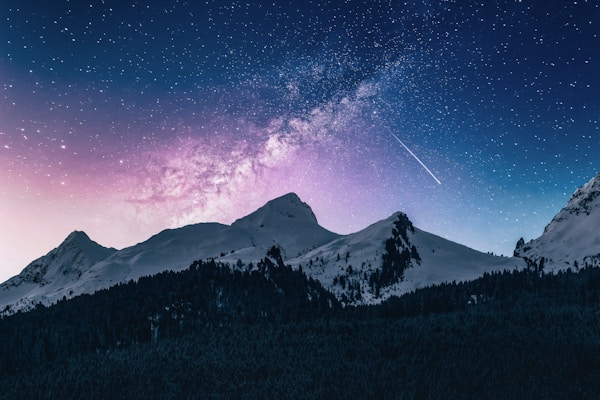 snow mountain under stars