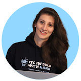 TechWorld with Nana - Smiling woman with long dark hair wearing a black shirt with white text against a blue circular background.