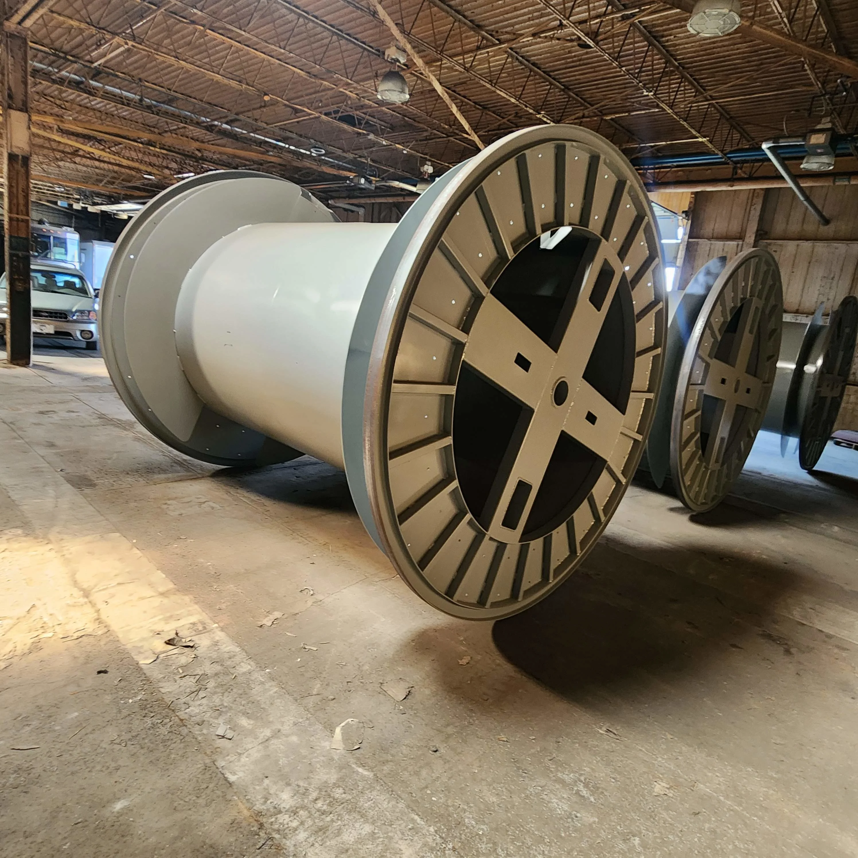Industrial wire reel manufacturing facility with large steel reels and reconditioning equipment#1.5