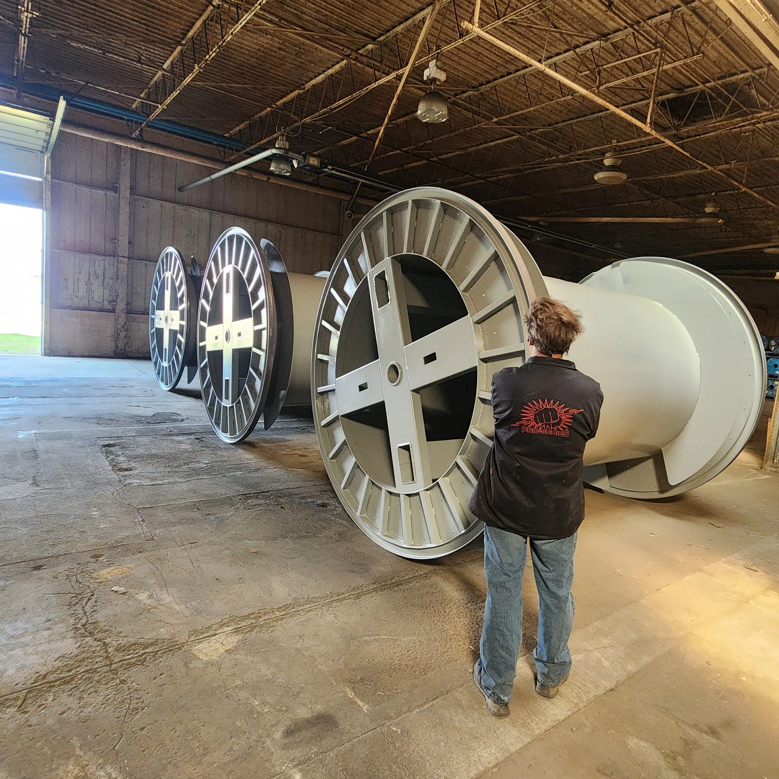 Professional HVAC technician working on commercial air conditioning system in Bryan Texas facility#1.5
