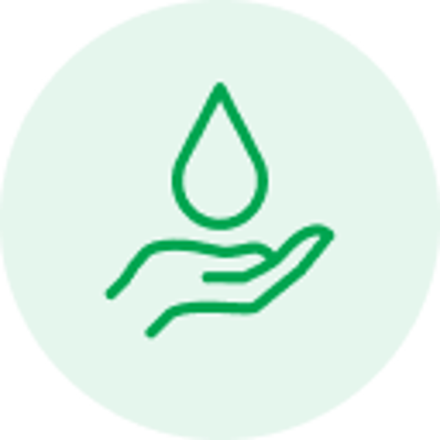 Green line icon of a hand holding a water droplet on a light green circular background.