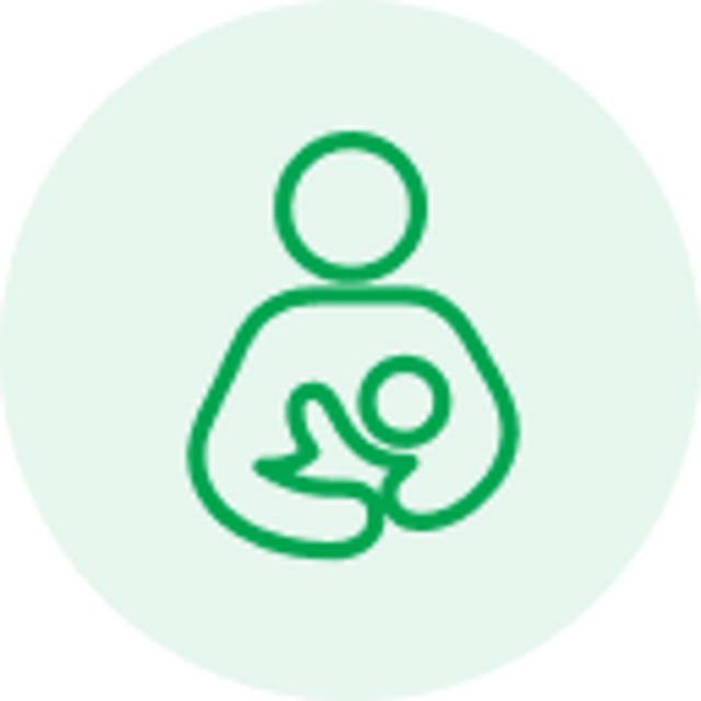 Green line icon of a person holding a baby on a light green circular background.