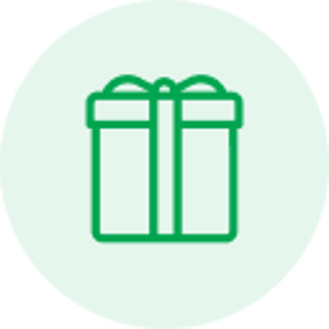 Green line icon of a gift box with a ribbon and bow on a light green circular background.