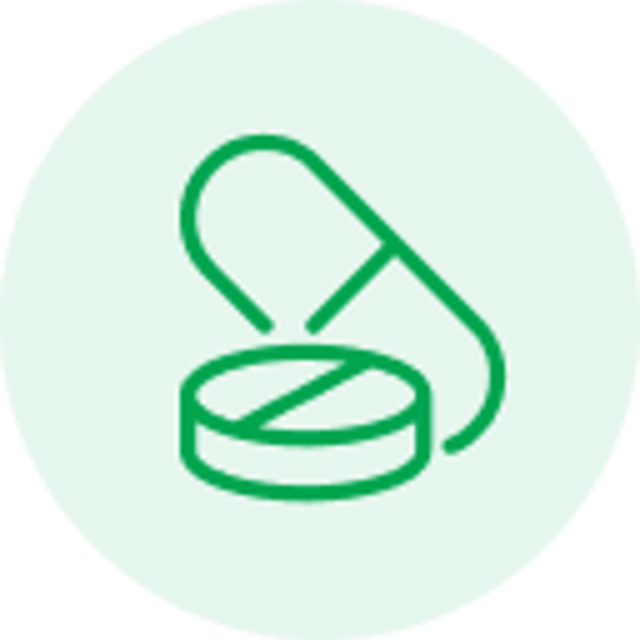 Green line icon of a capsule and a round pill on a light green circular background.