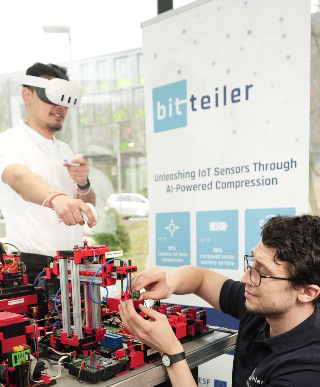 Team testing IoT hardware prototype with VR headset