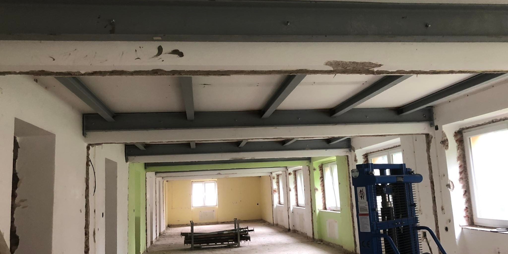 Structural ceiling reinforcement using HEB100 and UPE240 steel profiles during the reconstruction of a senior care facility in Žďár nad Sázavou.