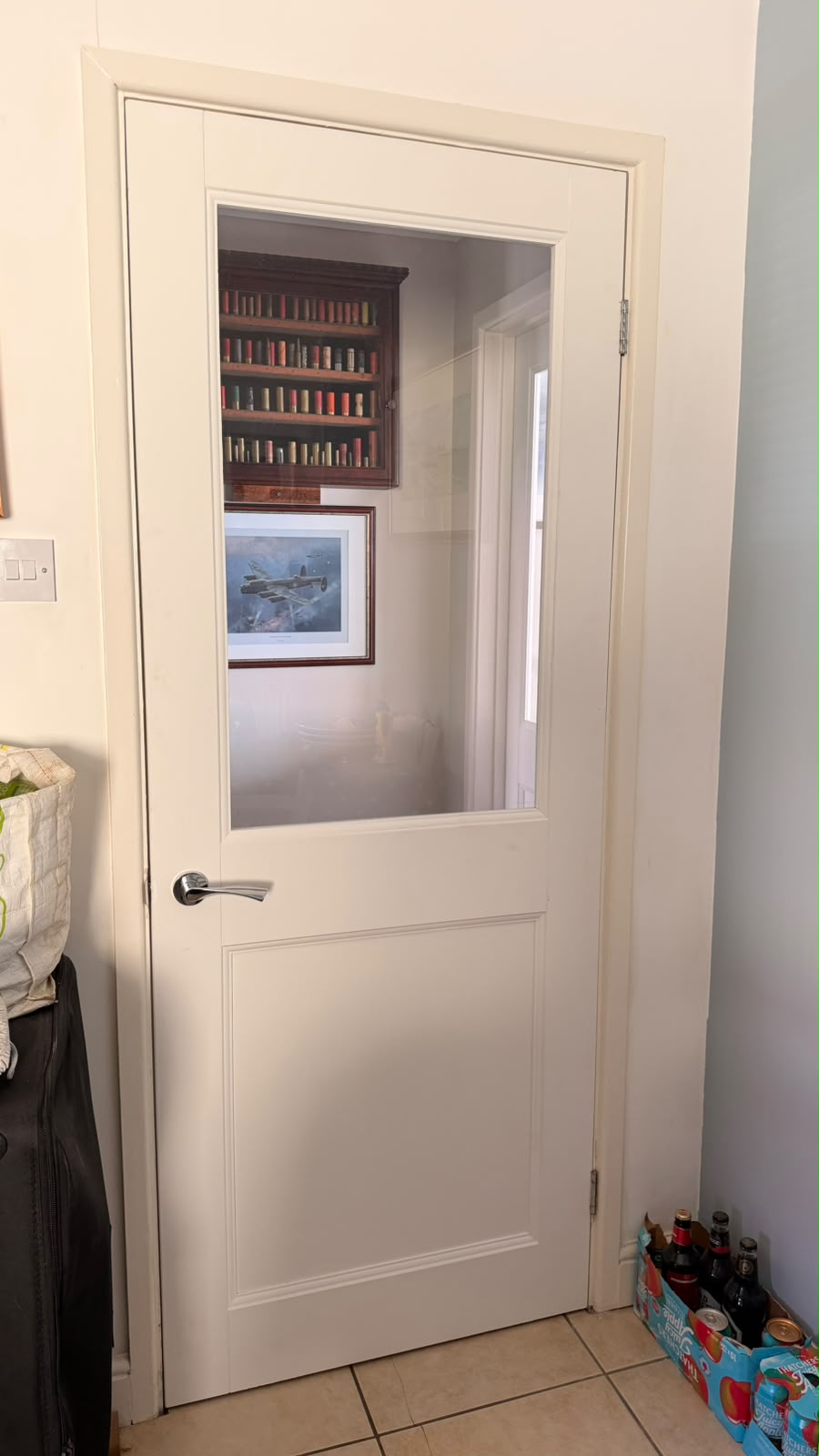 Primed Elmbridge glazed door above tiled flooring in Farnborough