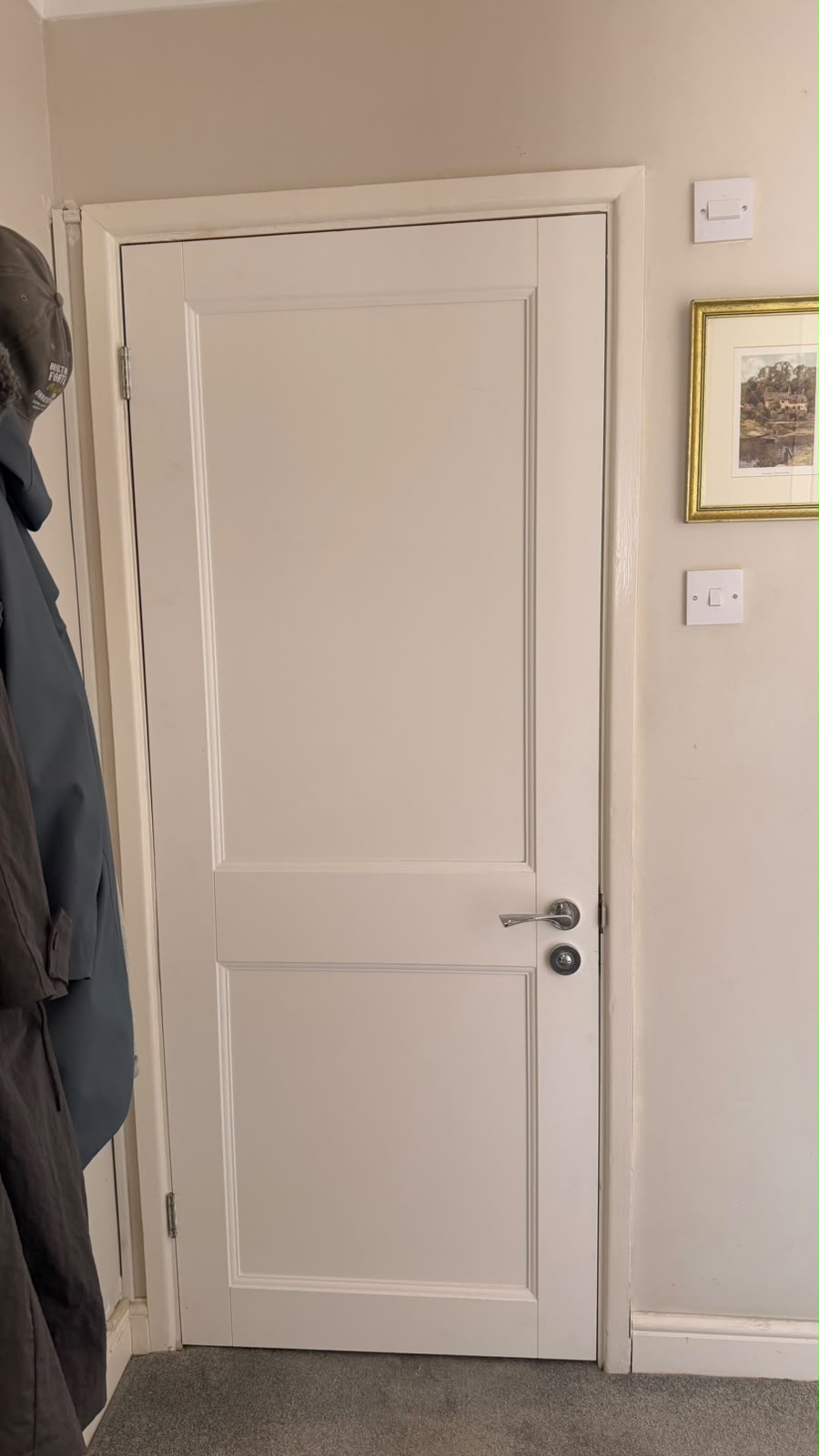Primed Elmbridge panel door with a silver lever handle and thumbturn in Farnborough