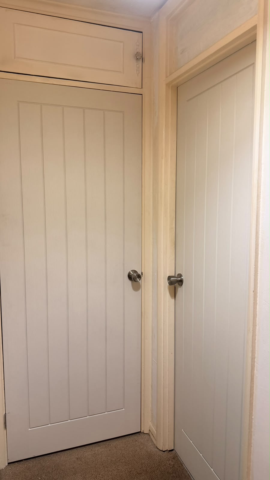 Two matching white cottage internal doors with silver round doorknobs fitted in Yateley