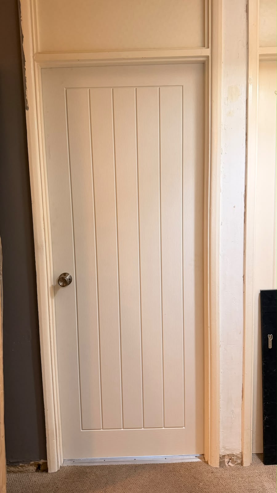 White cottage internal door with a silver round doorknob in a Yateley property