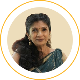 Portrait of a middle-aged woman with dark hair in a braid, wearing traditional attire and earrings, smiling slightly.