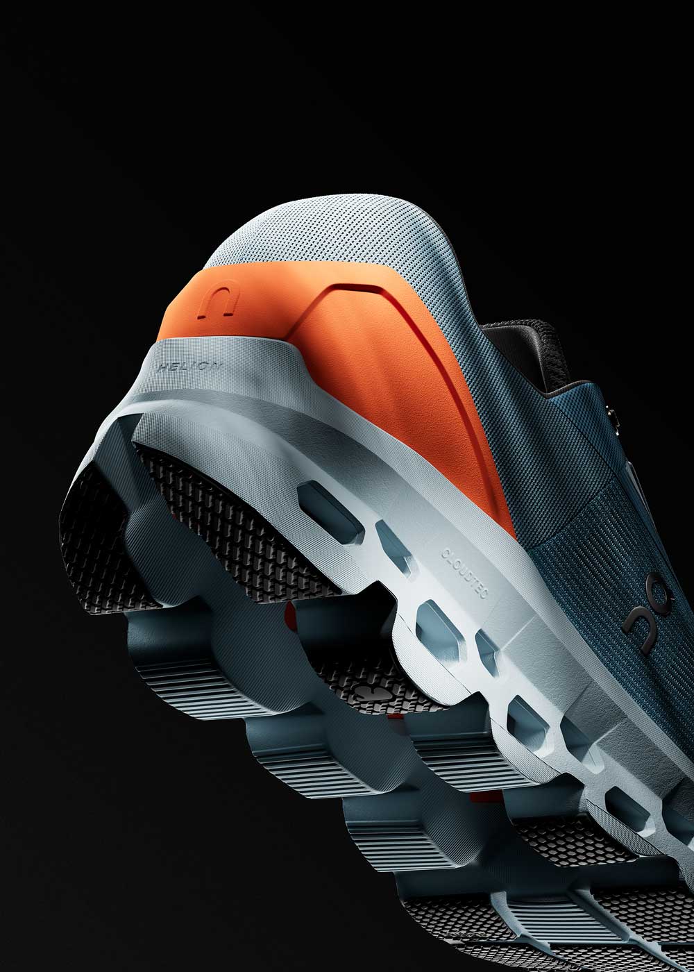 On Running Cloudstratus Laufschuh, Detailaufnahme der Clouditec-Sohle mit Helion-Zwischensohle in Grau und Orange