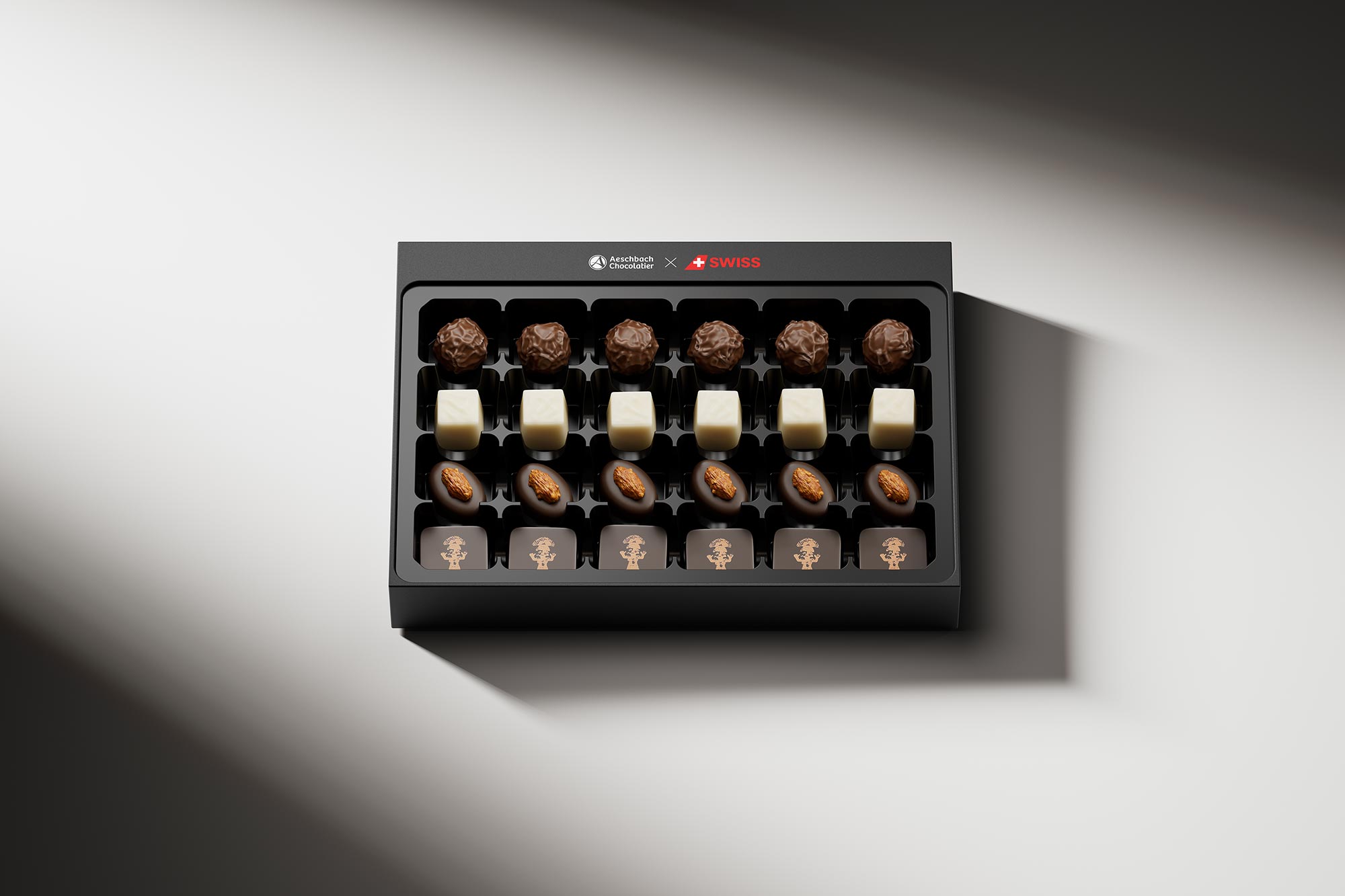 Aeschbach Chocolatier x SWISS Airlines Pralinenschachtel mit 24 handgefertigten Schweizer Pralinen in schwarzer Geschenkverpackung