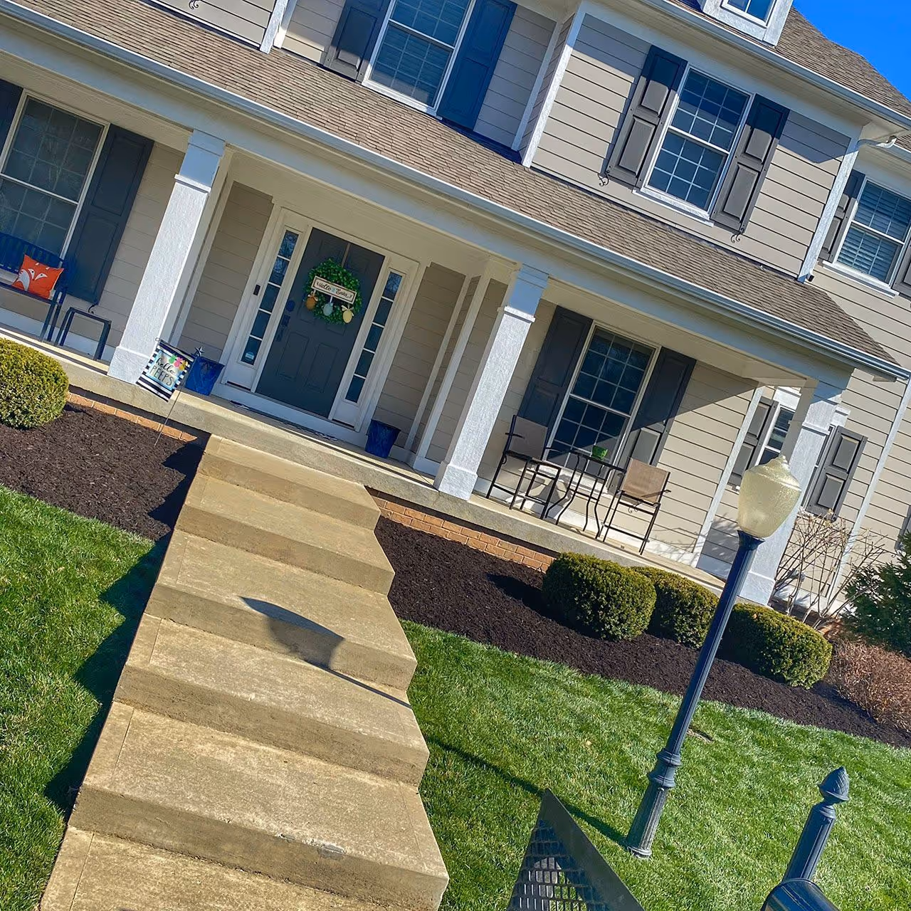 Lush green residential lawn cared for by Gould Brothers Outdoor Solutions LLC