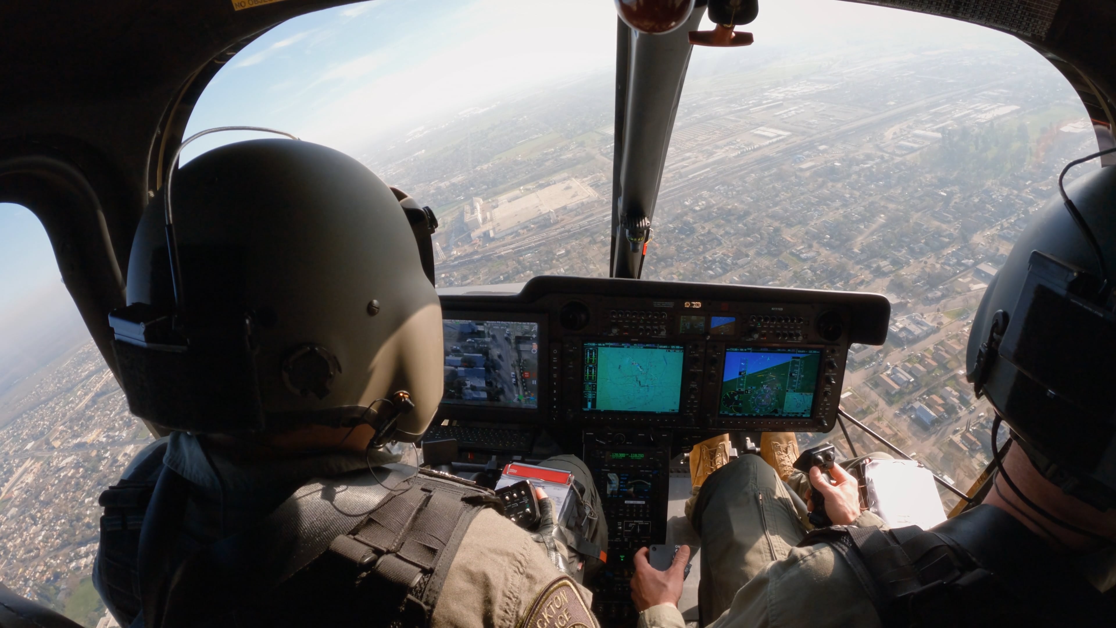Stockton Police Department's Bell 505 in flight looking out the window from the cockpit