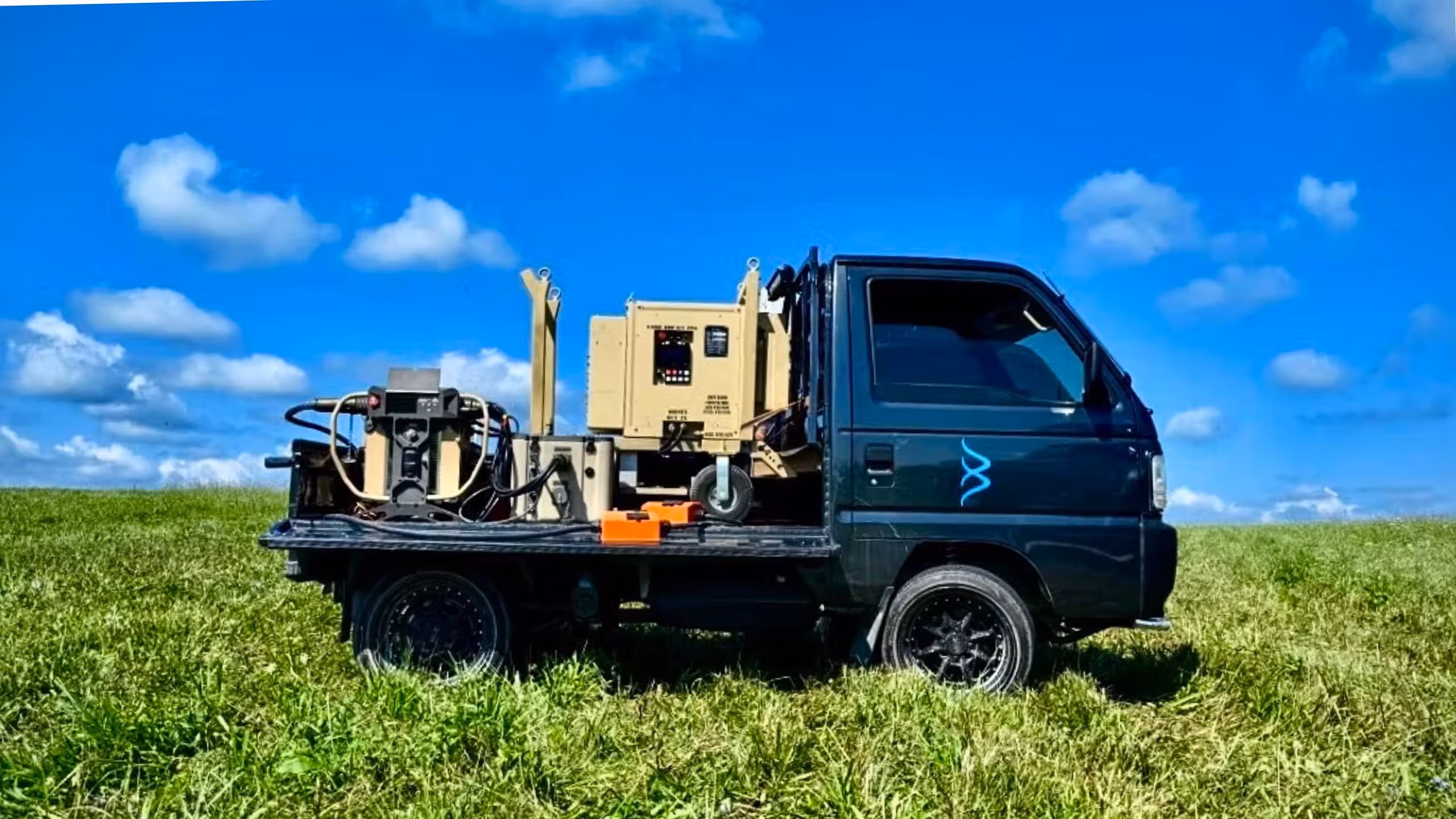 HAPU on back of pickup in a field