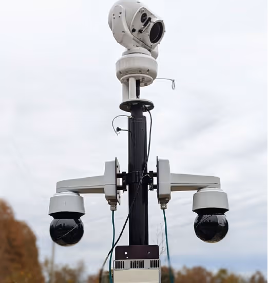 BlueSky Mast carrying a PTZ camera and two side-arm cameras