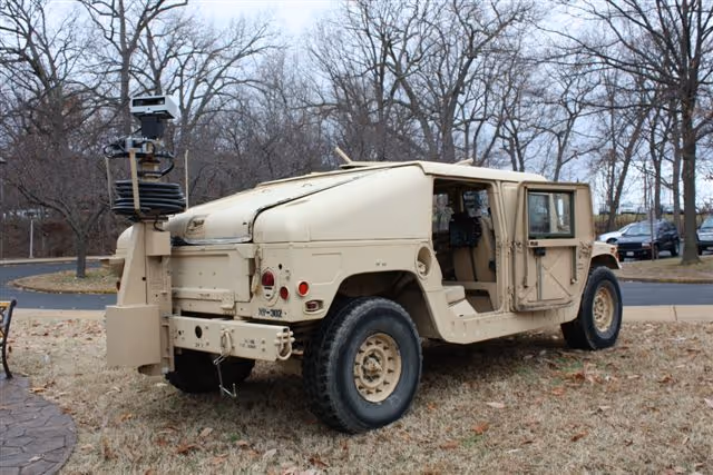 FM Series telescoping mast with a camera on a support vehicle