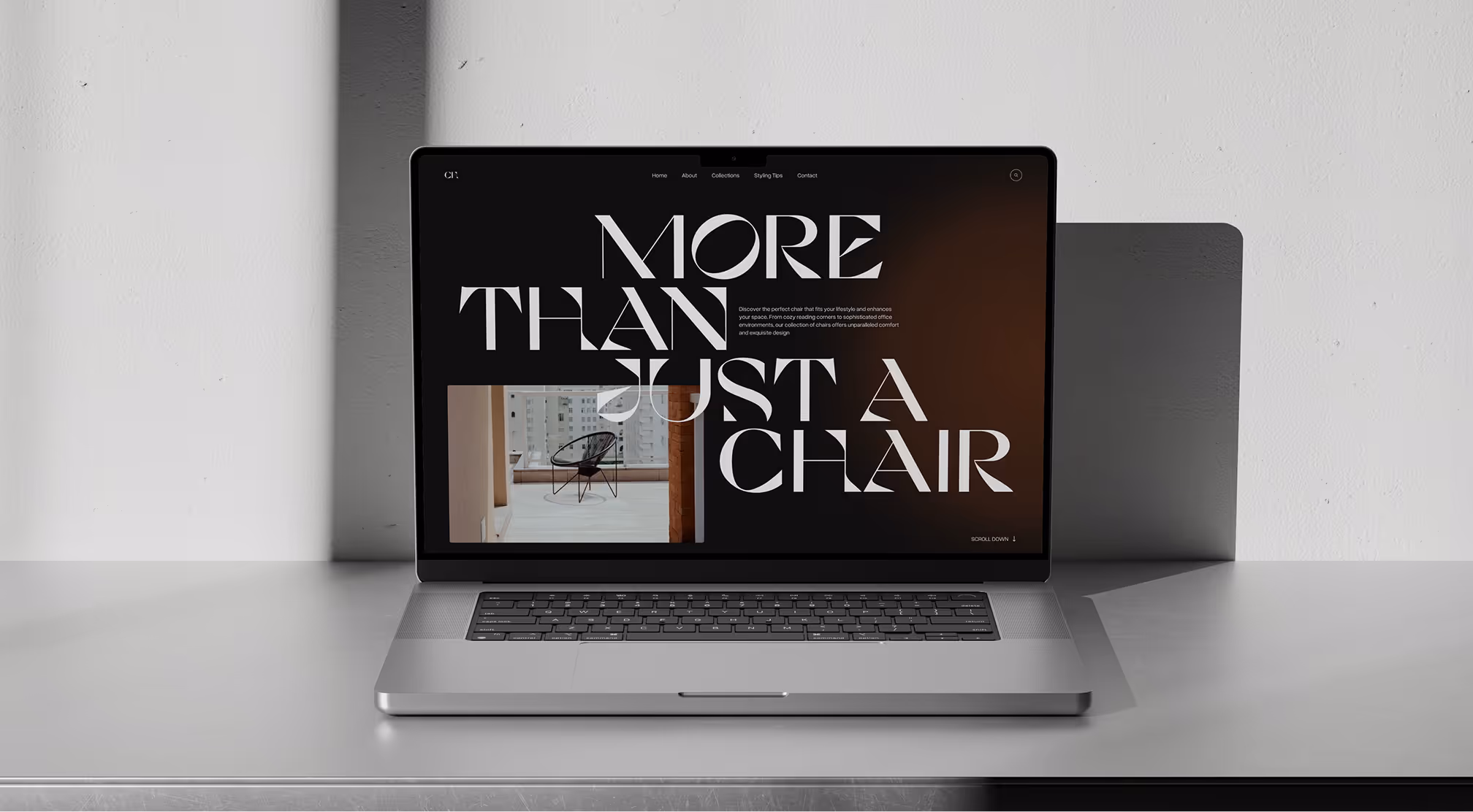 Laptop on gray table displaying a website with large text 'More than just a chair' and a chair photo.
