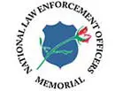 National Law Enforcement Officers Memorial logo featuring a blue shield with a red rose and green stem crossing diagonally.