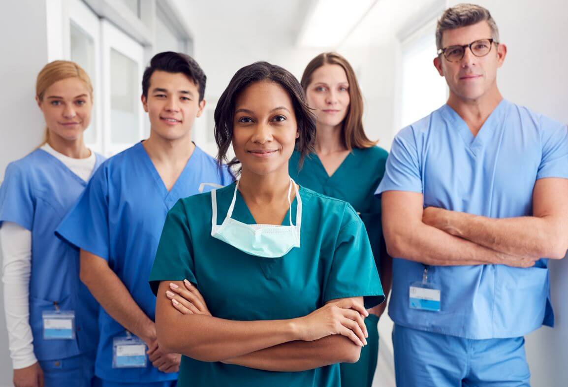 a group of doctors standing in a hallway