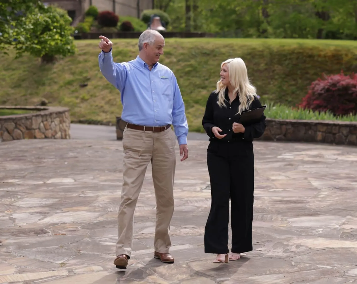 a man and a woman are walking together