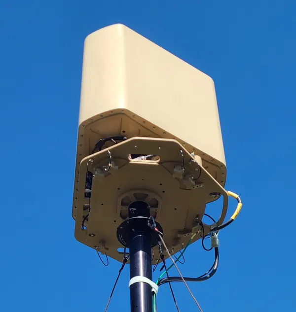 BlueSky Mast 350 Lift Series with Silvus Technologies StreamCaster MANET radio kit, deployed in the field, tactical communications application