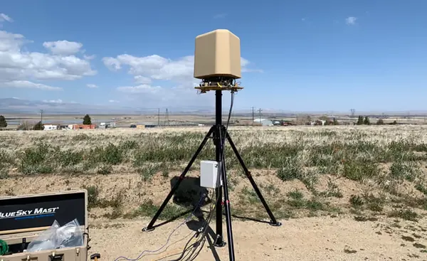 BlueSky Mast 350 Lift Series with Silvus Technologies StreamCaster MANET radio kit, deployed in the field, tactical communications application