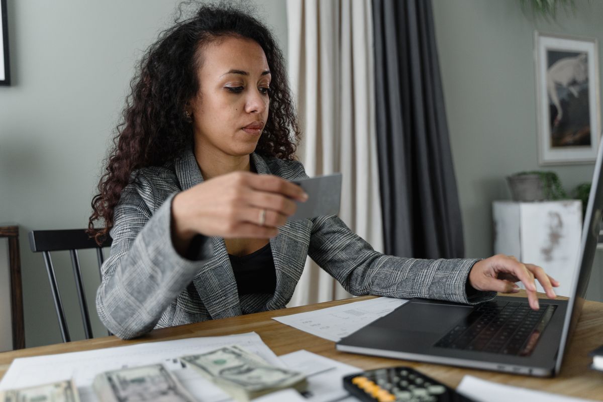 Business owner entering her own payment details on her laptop