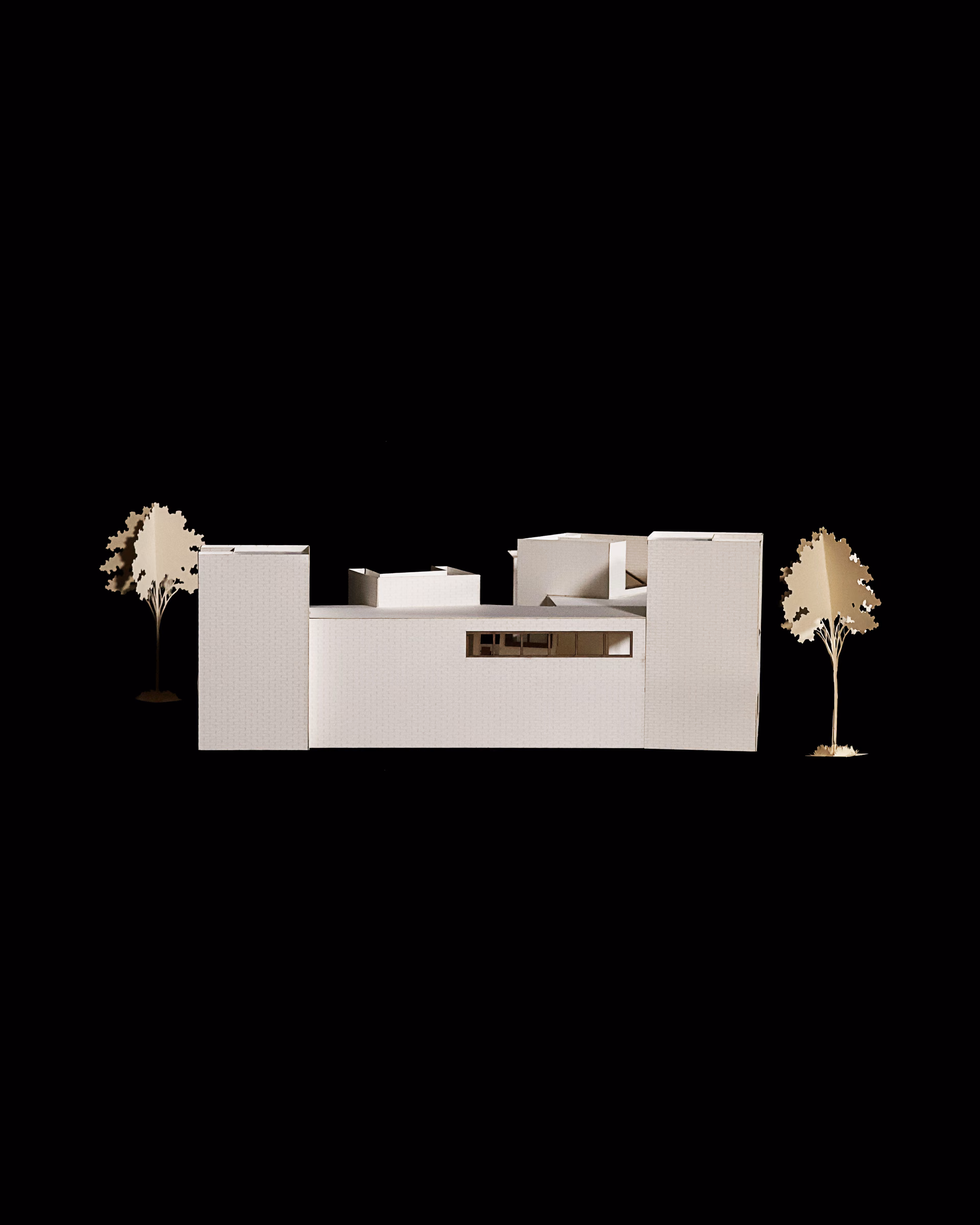 South elevation of the Sight Lines model, showing the long low facade and taller corner volume.
