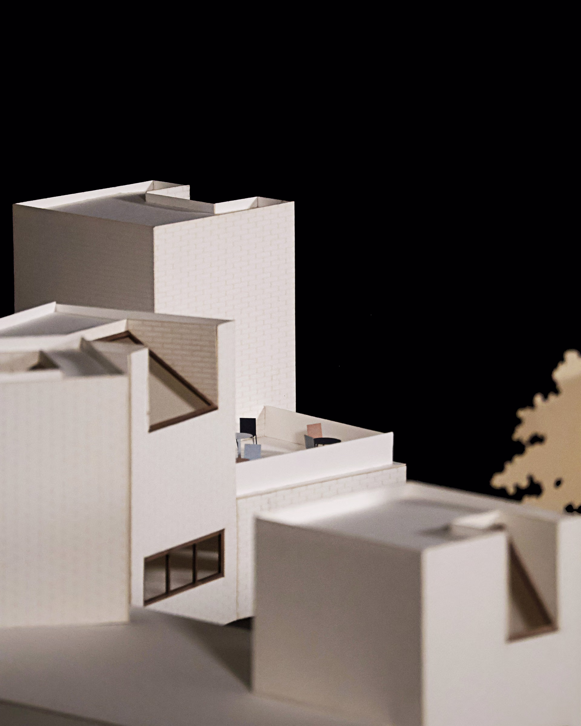 Close-up of the Sight Lines model, showing a tall tower, stepped roofs and framed openings.
