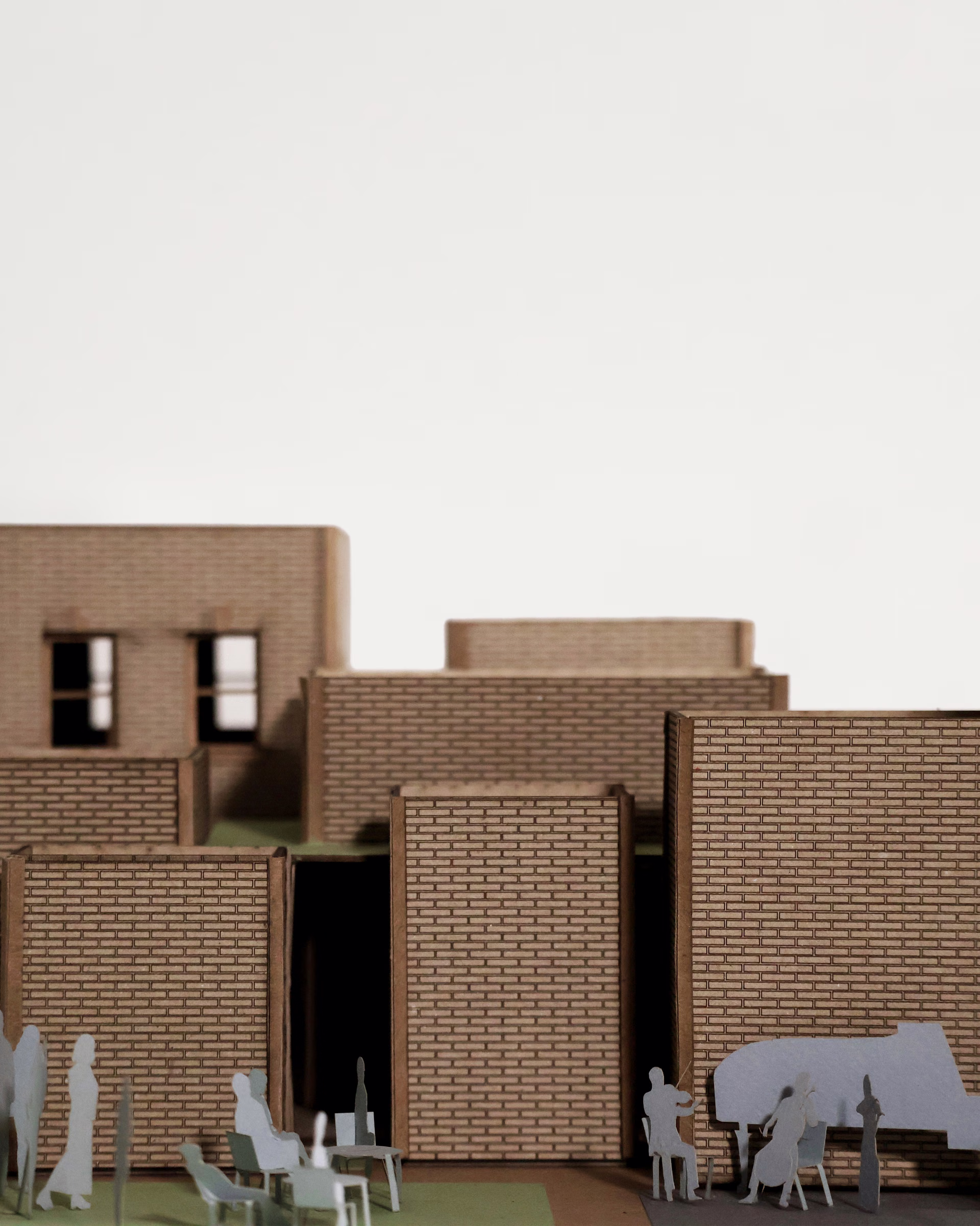 Close-up of The Audio Alcove model, showing a recessed entrance between textured brown walls.