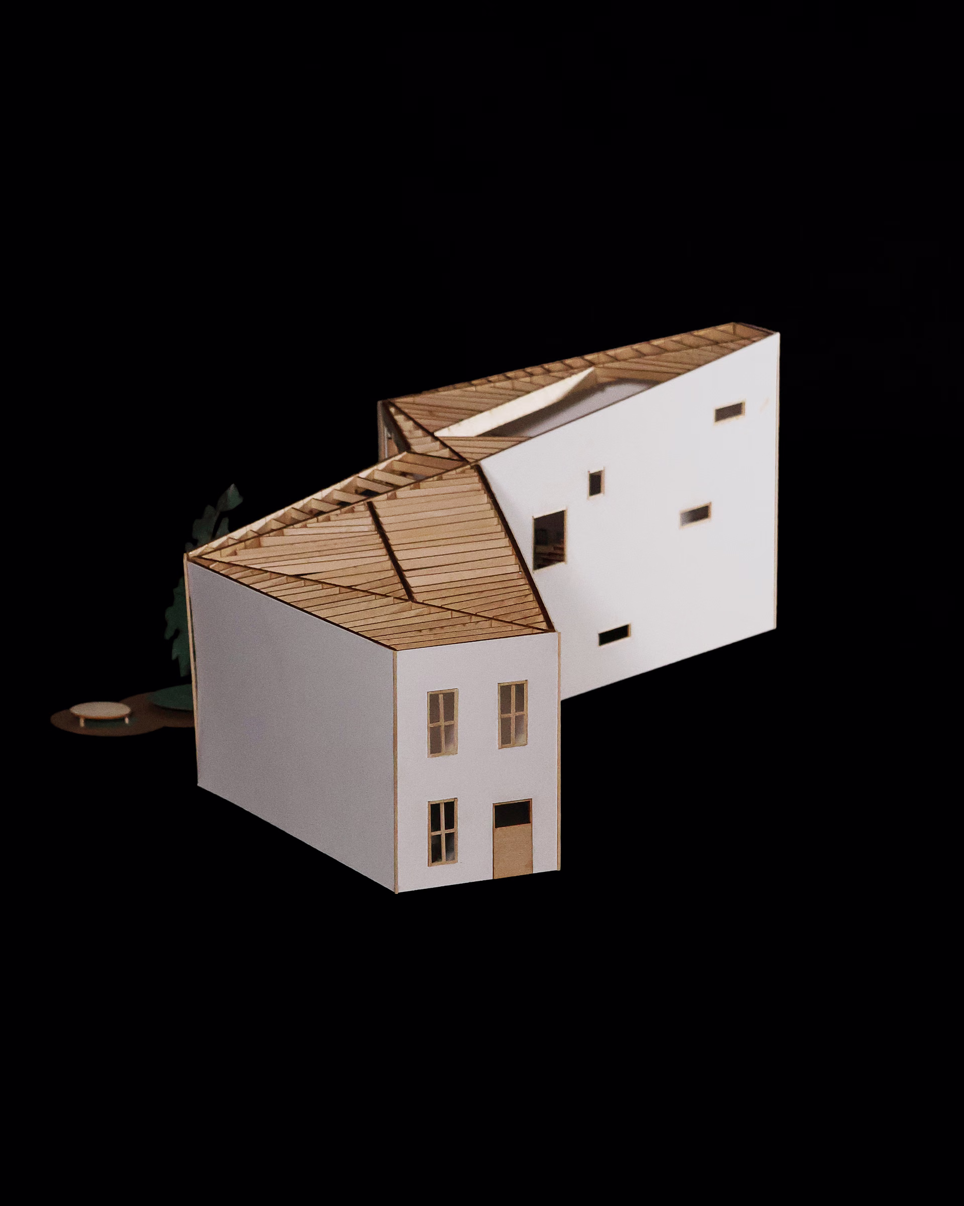 Overhead corner perspective of the Spatial Transitions model, showing exposed timber rafters and angled white walls.