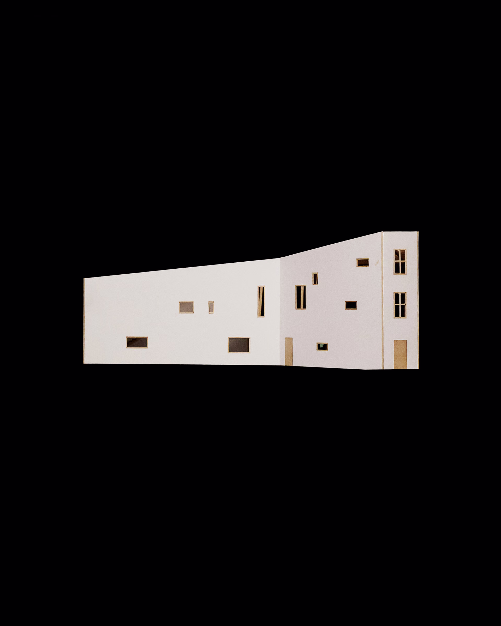 Alternate long elevation of Spatial Transitions, showing the rising roofline and varied window positions.
