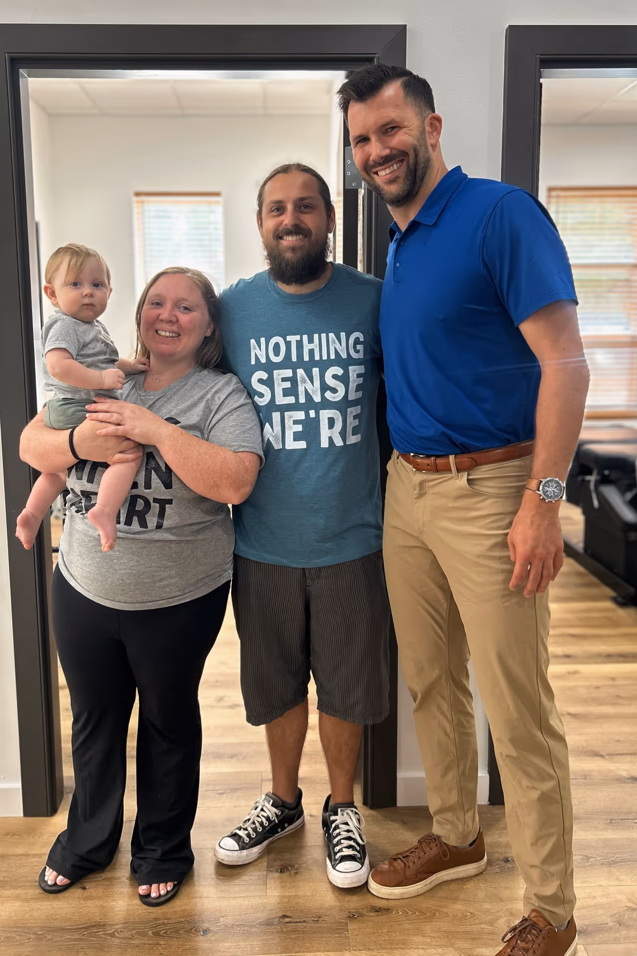 A happy Northshore family posing with Dr. Jason O’Rear in the Mandeville facility after completing a successful corrective chiropractic care plan.
