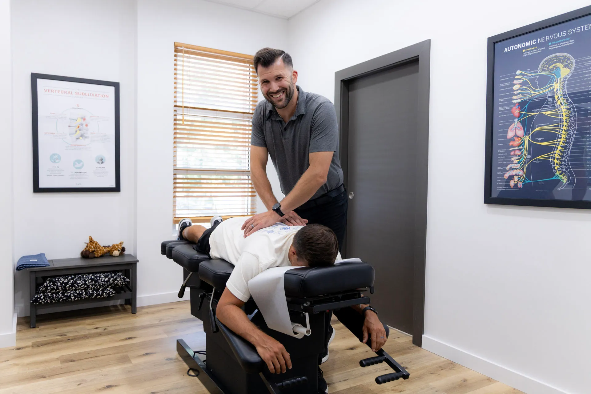Dr. Jason O’Rear performing a precise structural spinal correction at Limitless Chiropractic in Mandeville, LA, helping a patient restore optimal spinal curvature.