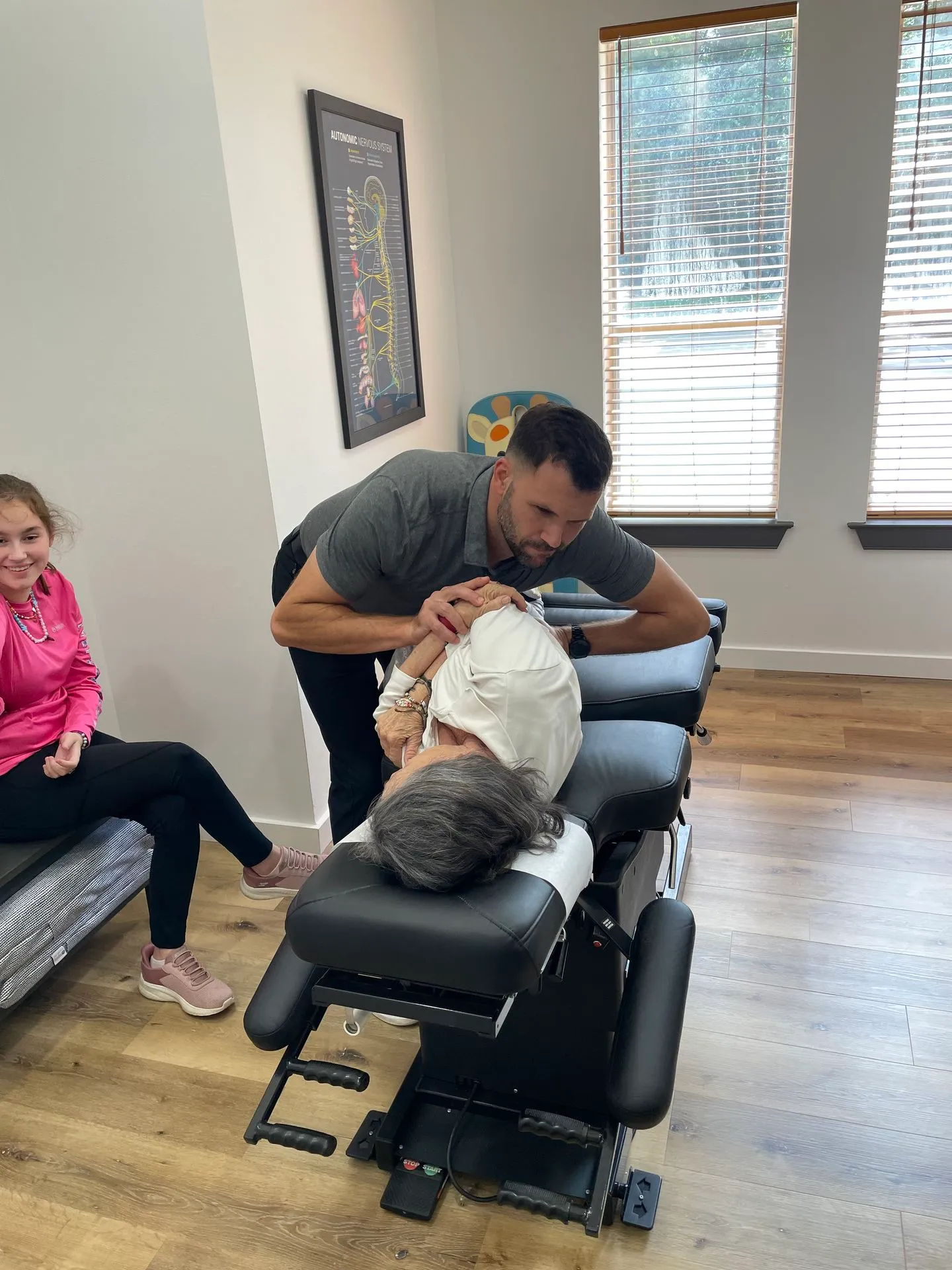 Corrective chiropractic adjustment at Limitless Chiropractic focusing on restoring natural spinal curvature and posture.