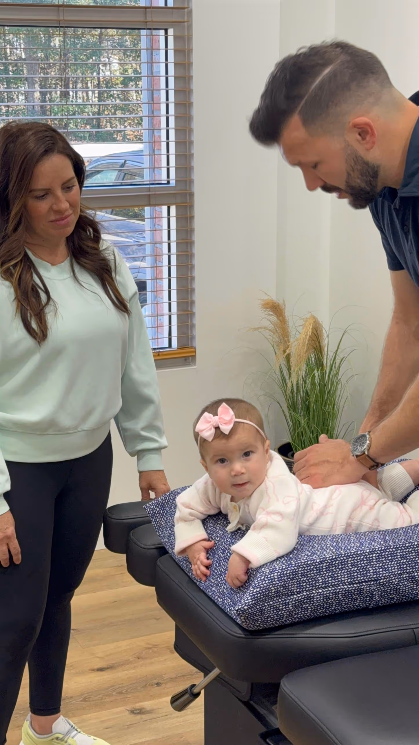 Gentle pediatric chiropractic adjustment for a newborn in Mandeville to support early neurological development and wellness.